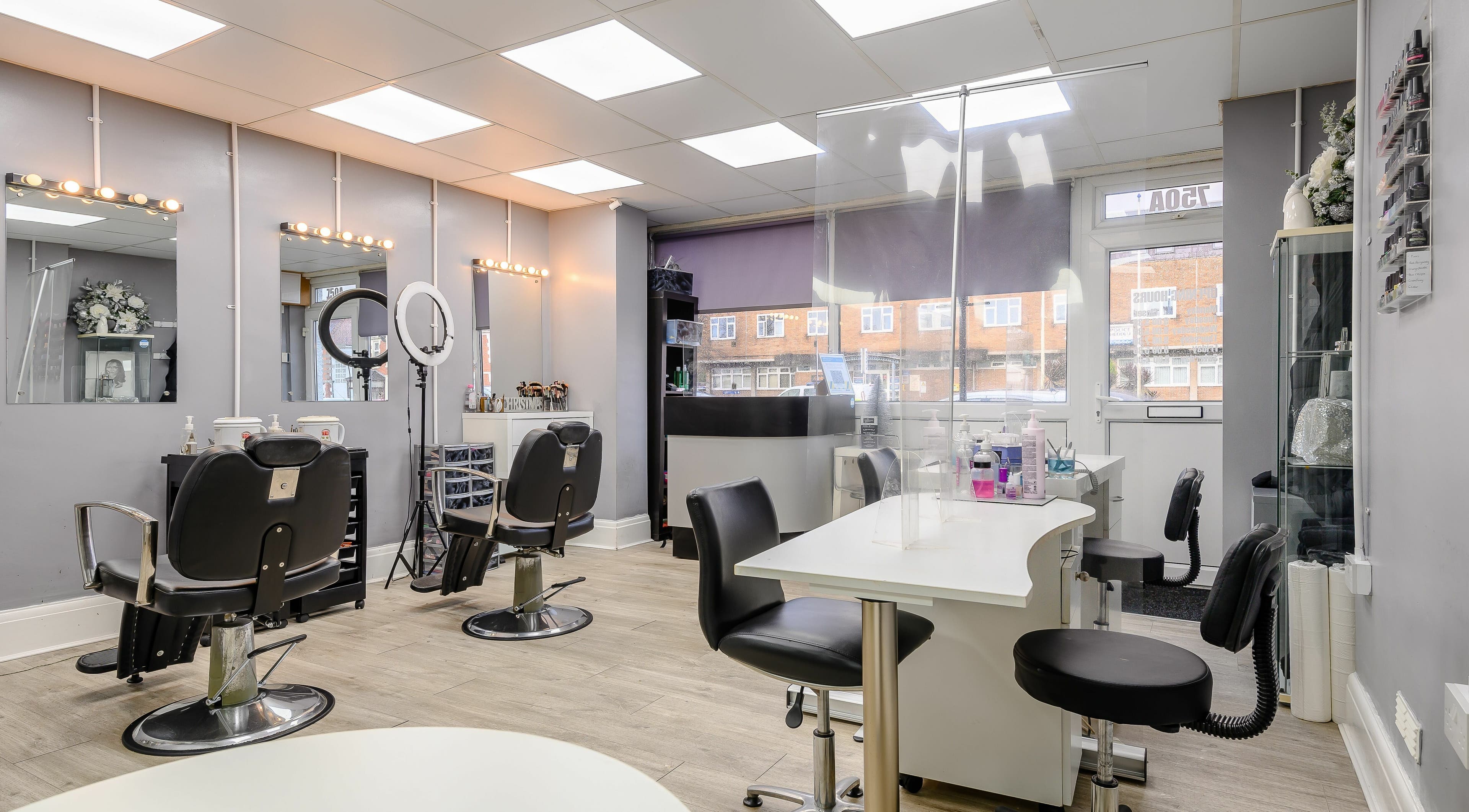 Modern interior of Missy Beautique in Rumney, Wales, GB showcasing elegant salon and manicure stations.