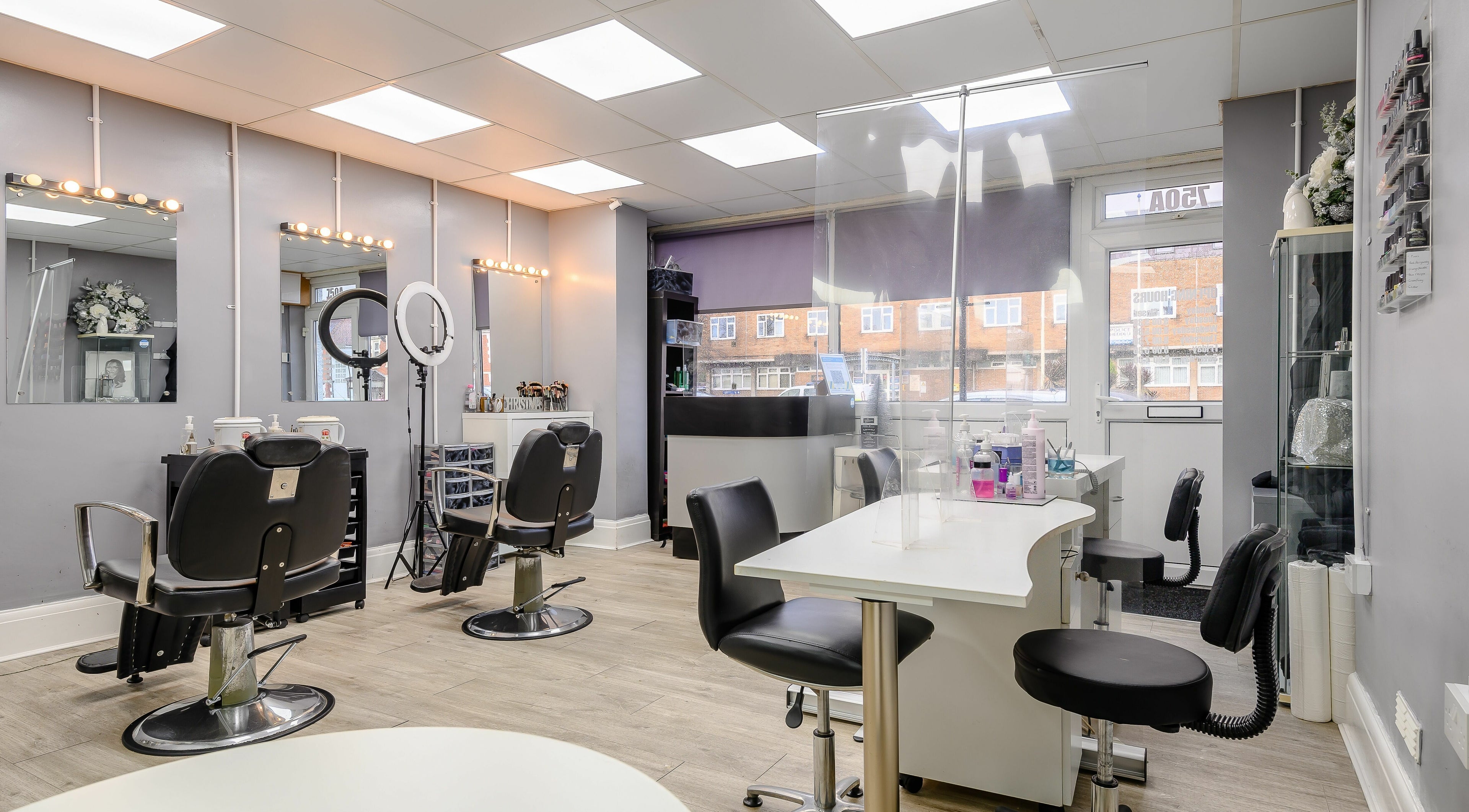 Modern interior of Missy Beautique in Rumney, Wales, GB showcasing elegant salon and manicure stations.