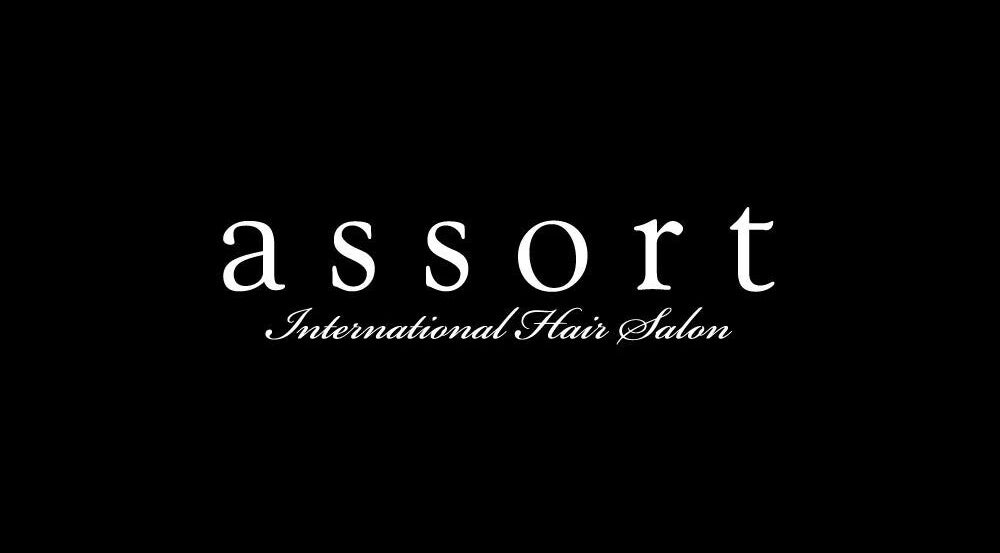 Assort Los Angeles (Popup) logo in elegant script, representing a premier salon in Los Angeles, California, US.
