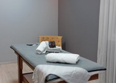 Tranquil massage room at Novva spa & beauty center, İstanbul, İstanbul, TR with cozy bed and luxurious ambiance.