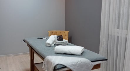 Tranquil massage room at Novva spa & beauty center, İstanbul, İstanbul, TR with cozy bed and luxurious ambiance.