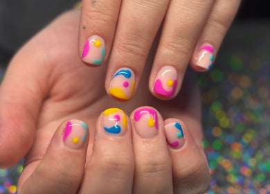 Vibrant nail art design at SCULPTED BY LIZA, Bowling Green, Ohio, US, showcasing colorful, modern patterns.