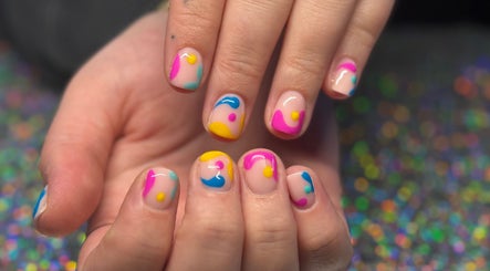 Vibrant nail art design at SCULPTED BY LIZA, Bowling Green, Ohio, US, showcasing colorful, modern patterns.