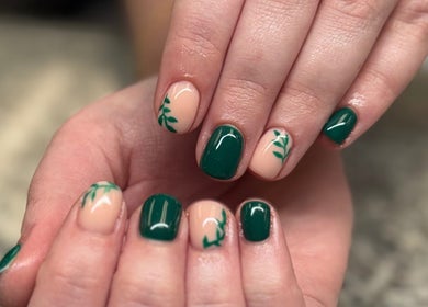 Leafy nail art in green tones at SCULPTED BY LIZA, Bowling Green, Ohio, US, showcasing intricate design.