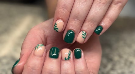 Leafy nail art in green tones at SCULPTED BY LIZA, Bowling Green, Ohio, US, showcasing intricate design.