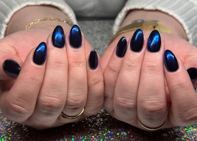 Glossy dark blue nails by SCULPTED BY LIZA in Bowling Green, Ohio, US, showcasing elegant nail art.