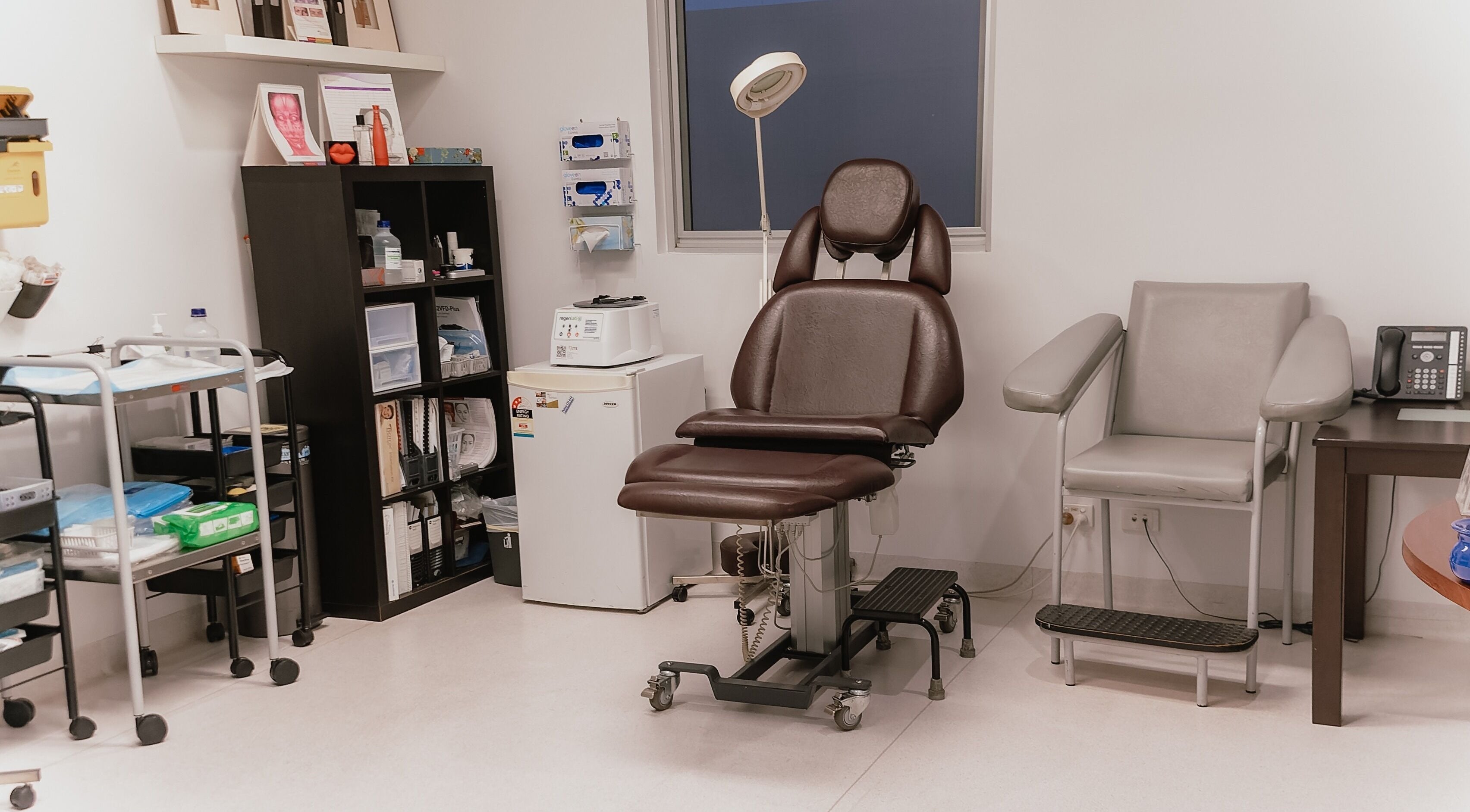 Aestiqua Clinic treatment room in Kelmscott, Western Australia, AU featuring a brown leather chair.