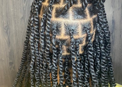 Intricate twisted braids at Done_byty in Katy, Texas, US, showcasing detailed hairstyling artistry.
