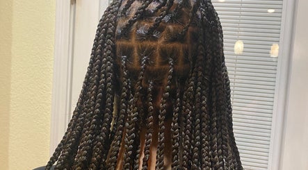 Stylish braided hairstyle at Done_byty, Katy, Texas, US.
