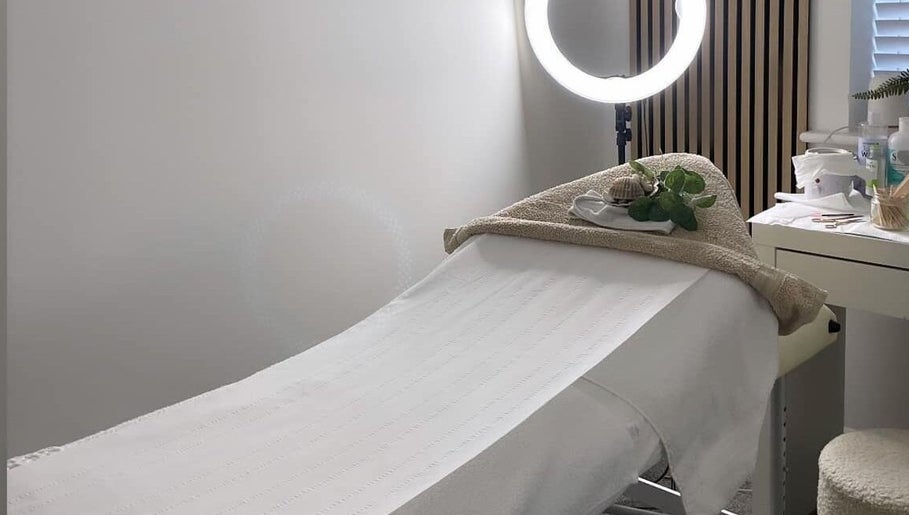 Relaxing treatment bed at Lilly's Lashes in Bellbowrie, Queensland, AU, with calming decor and lighting.