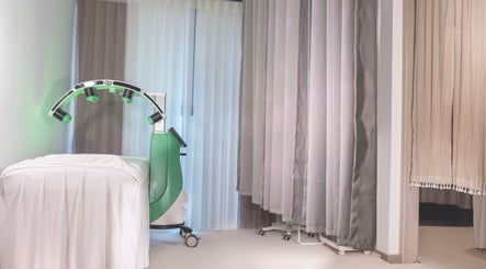Treatment room at Sage Oasis Beauty Studio, Singapore, SG showcasing a modern therapy setup.