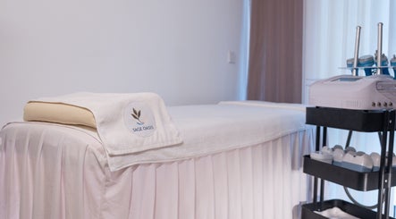 Luxury treatment room at Sage Oasis Beauty Studio, Singapore, Singapore, SG with plush massage table.