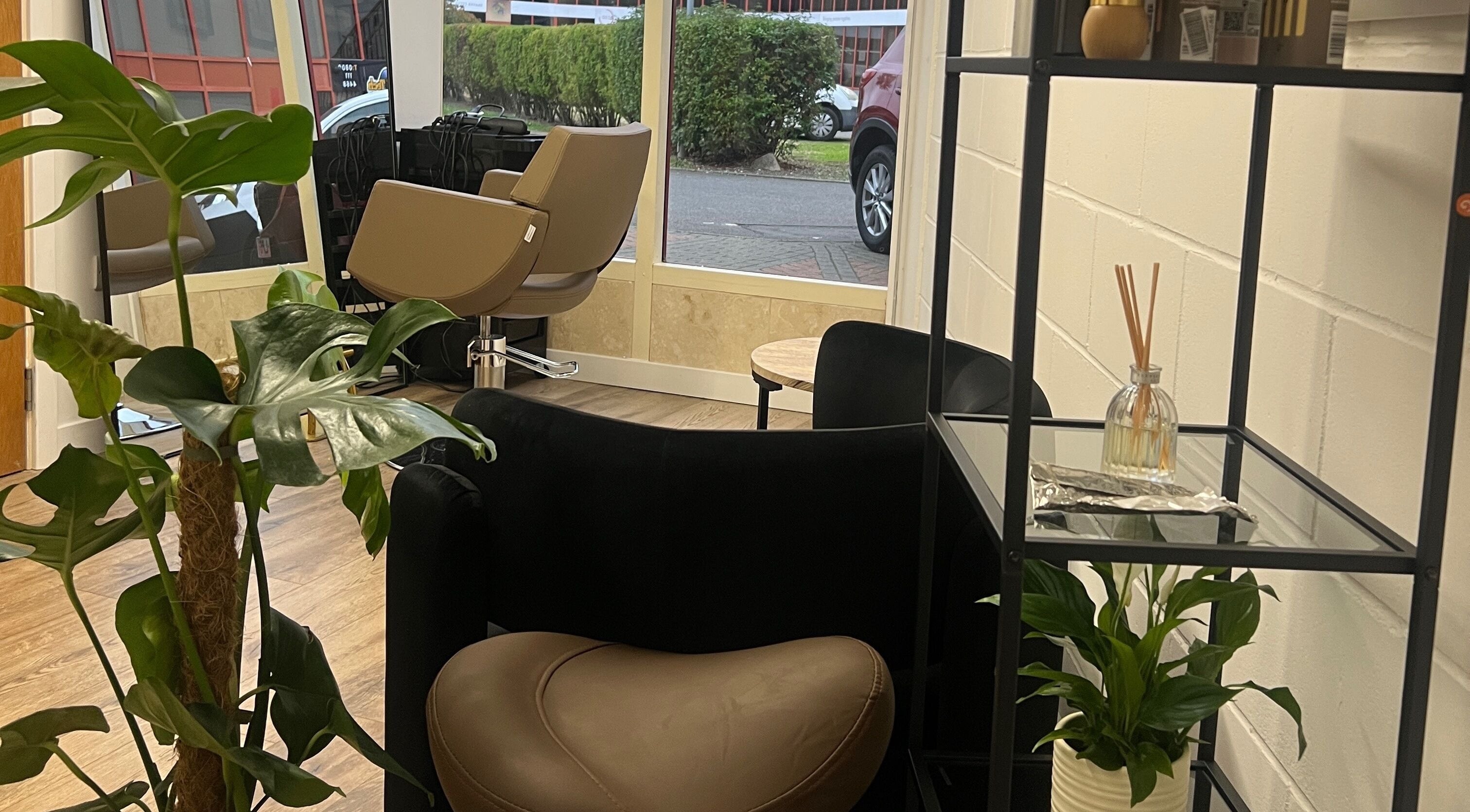 Modern salon seating with plants at The Alex’s Lounge, Peterborough, England, GB.