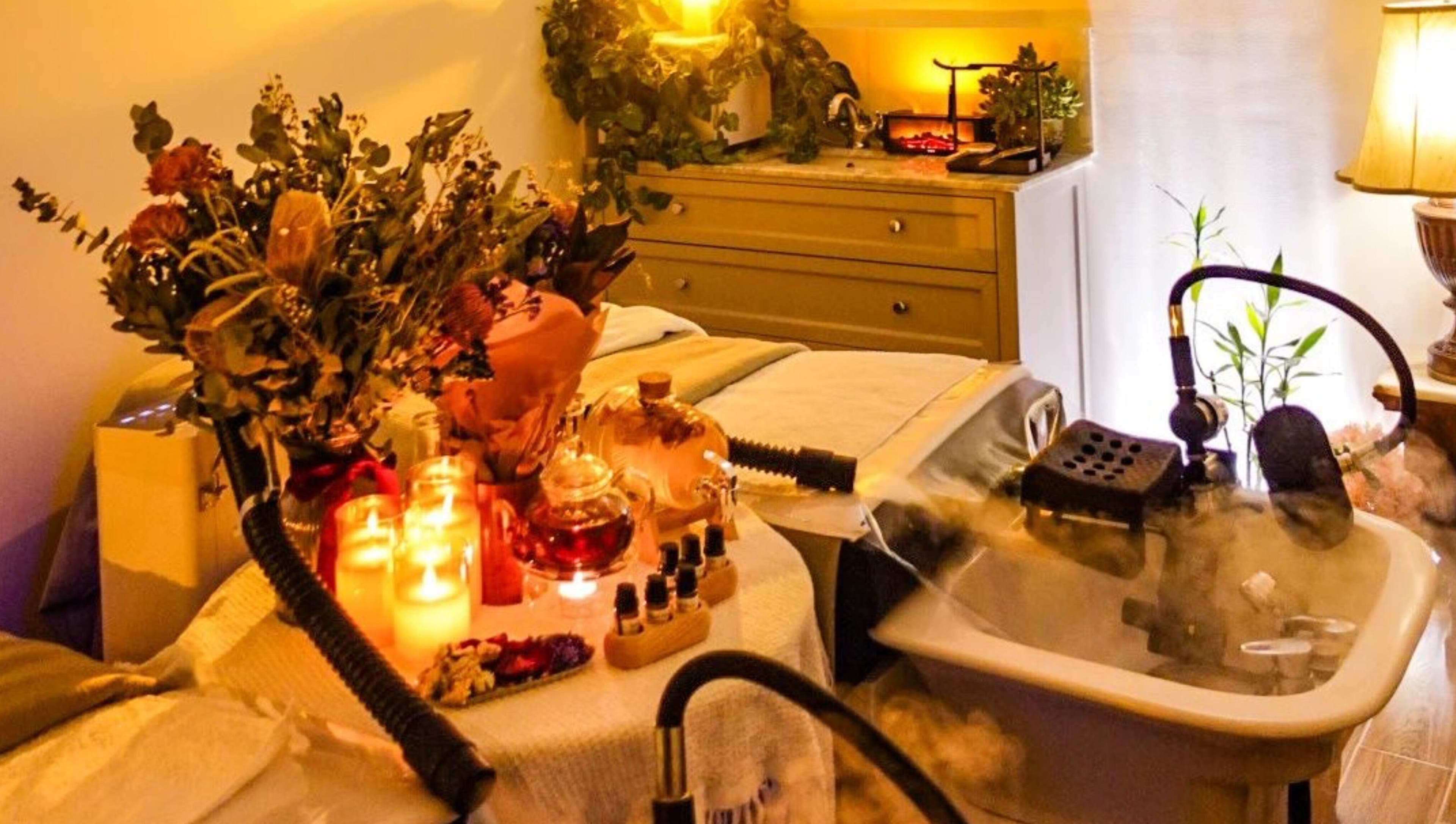 Relaxing spa setup with candles and flowers at M.Y. True Beauty, Burwood, New South Wales, AU.