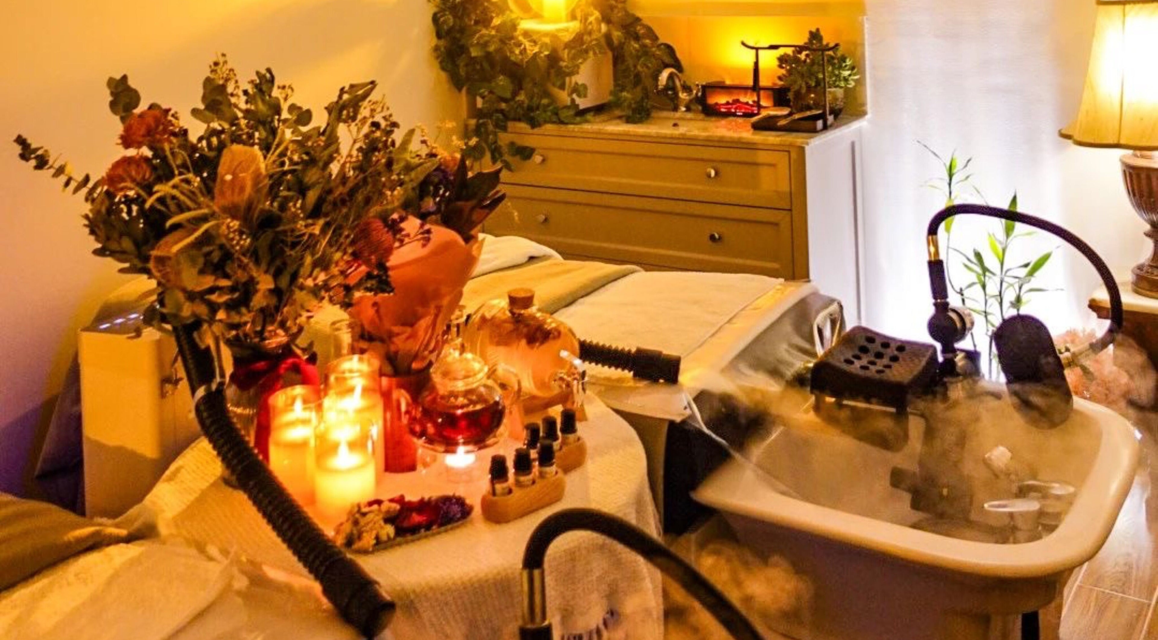 Relaxing spa setup with candles and flowers at M.Y. True Beauty, Burwood, New South Wales, AU.