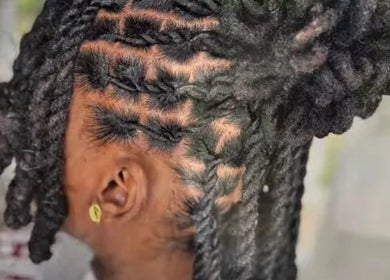 Intricate locs hairstyle at J & M Love & Locs, Barking, England, GB, showcasing detailed craftsmanship.