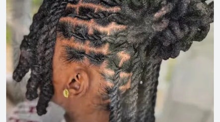 Intricate locs hairstyle at J & M Love & Locs, Barking, England, GB, showcasing detailed craftsmanship.