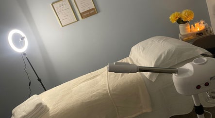 Relaxing treatment room at Soleil Skin Studio, Port Tennant, Wales, GB with warm lighting and cozy ambiance.