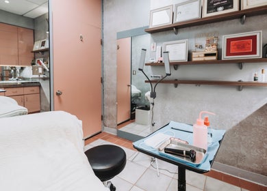 Elegant treatment room at BROW DIRECTION, Honolulu, Hawaii, US, showcasing modern furnishings and clean design.