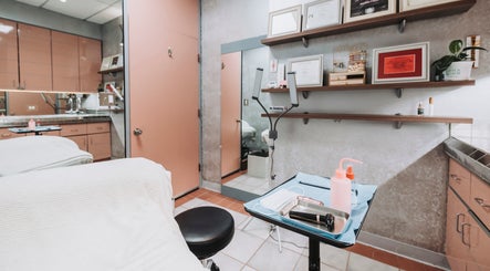 Elegant treatment room at BROW DIRECTION, Honolulu, Hawaii, US, showcasing modern furnishings and clean design.