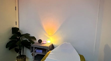 Calming massage room at Sasima Thai Massage Windsor in Windsor, England, GB with soft lighting and relaxing decor.