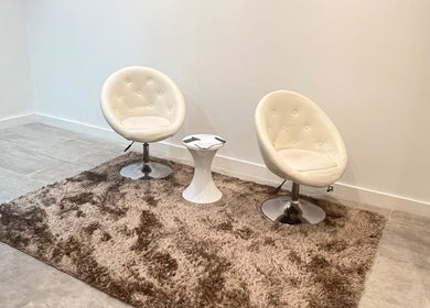 Inviting seating area at Sasima Thai Massage Windsor, Windsor, England, GB with plush chairs and soft carpet.