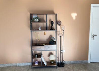 Chic shelving and floor lamp in Sasima Thai Massage Windsor, offering a warm, inviting atmosphere in Windsor, England, GB.