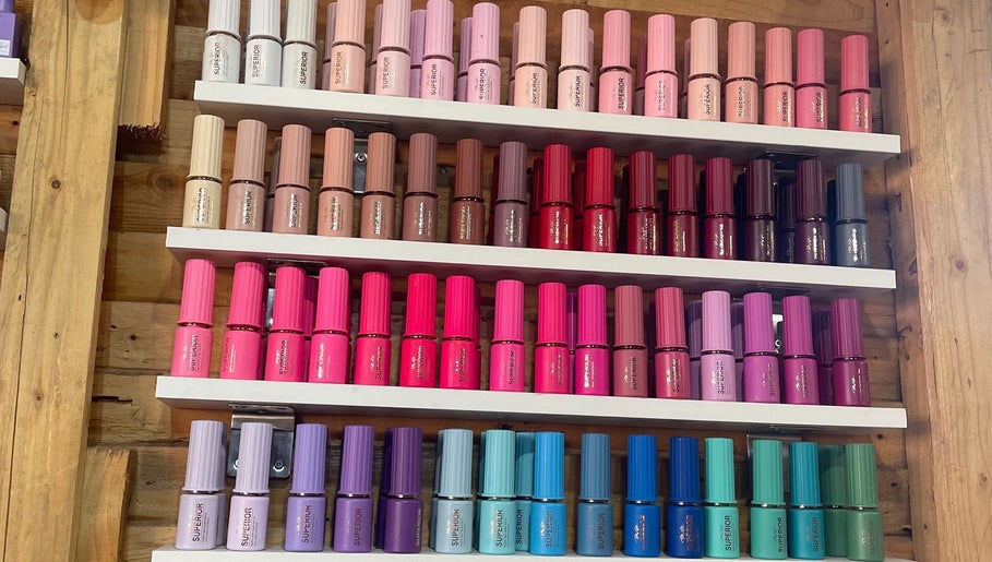 Vibrant nail polish collection at Monate Nails, Soweto, Gauteng, ZA, showcasing diverse color options.