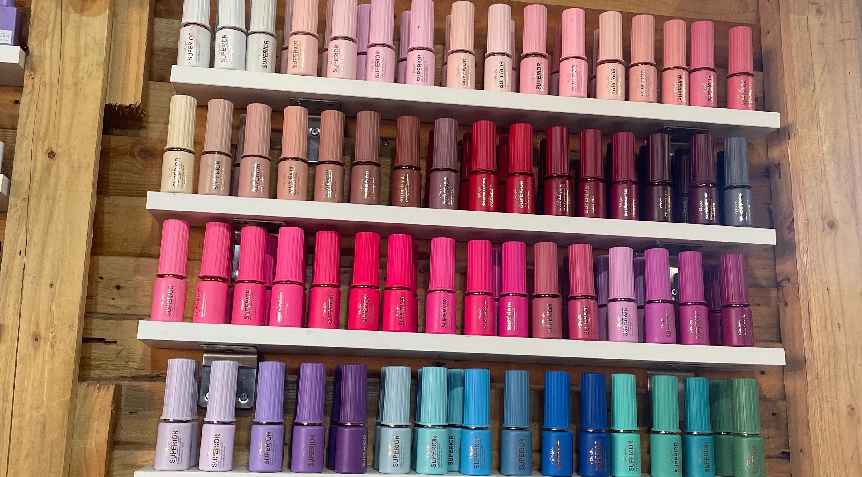 Vibrant nail polish collection at Monate Nails, Soweto, Gauteng, ZA, showcasing diverse color options.