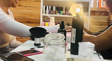 Guests enjoying nail treatment at Monate Nails, Soweto, Gauteng, ZA with various manicure tools visible.