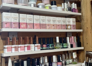 Nail polish display at Monate Nails, Soweto, Gauteng, ZA showcases vibrant nail care products.