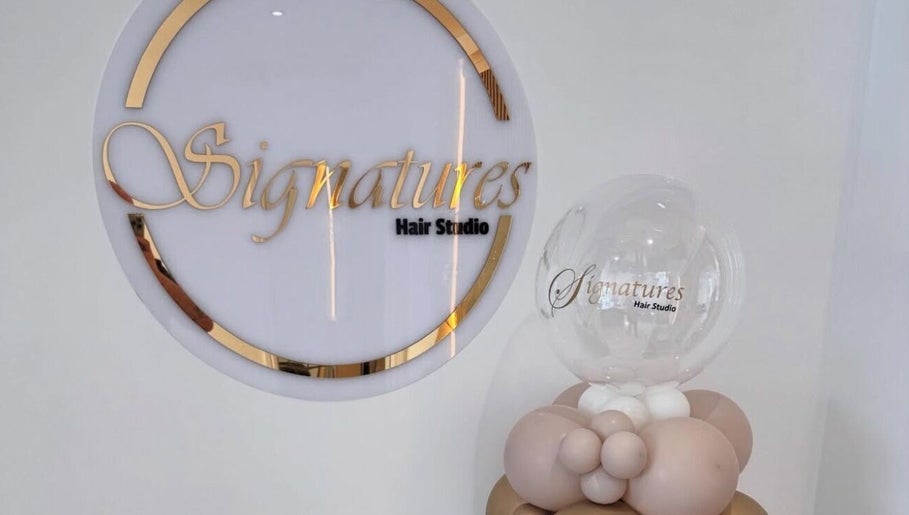 Elegant Signatures Hair Studio logo with balloon decor at TJJ_Hair, Crawley, England, GB.