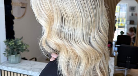 Elegant blonde waves styled at TJJ_Hair, Crawley, England, GB, showcasing luxurious hair texture.