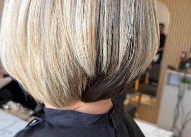 Stylish blonde bob haircut at TJJ_Hair, Crawley, England, GB showcasing smooth layers.