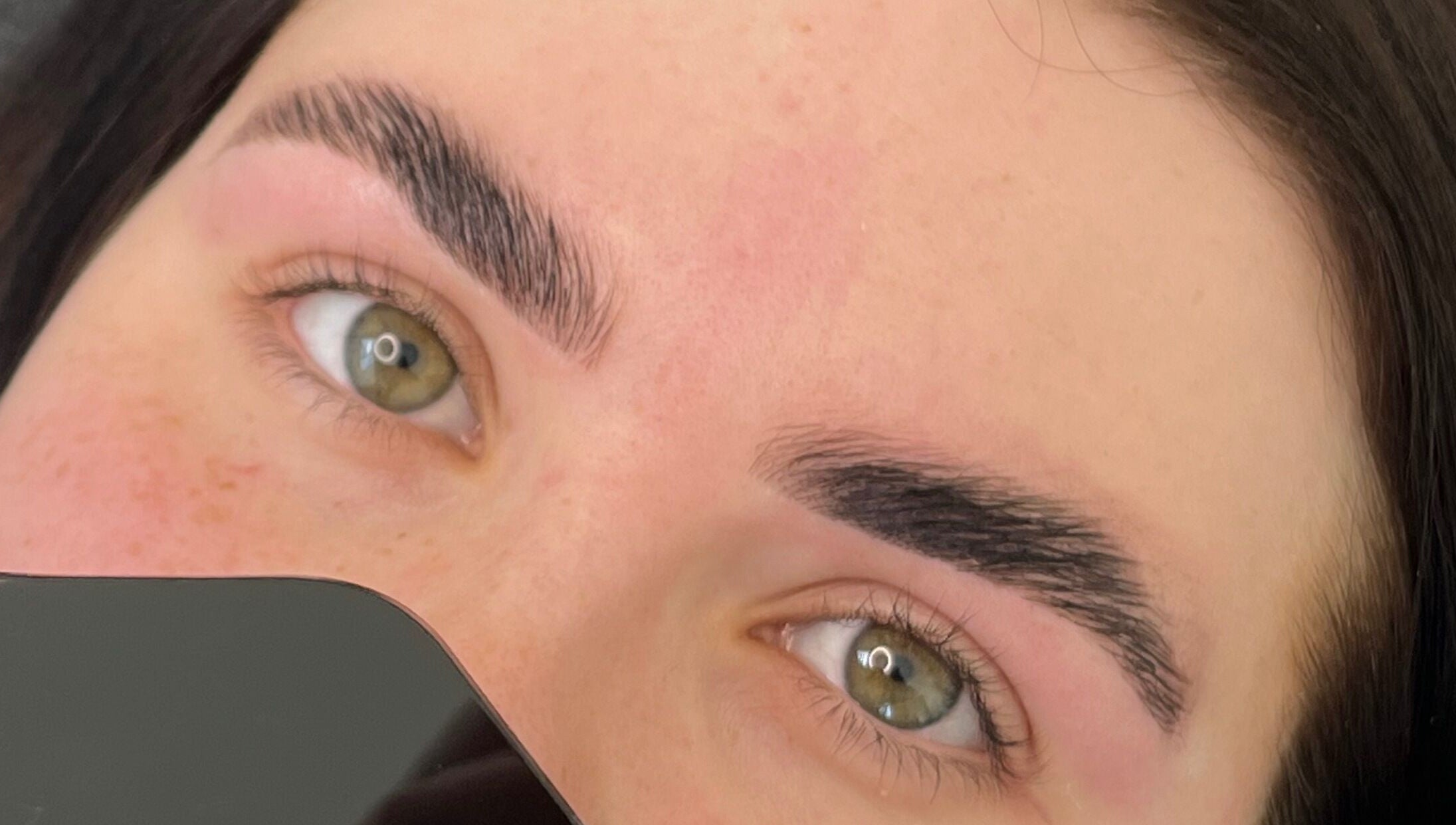 Close-up of expertly shaped eyebrows at Trackside Beauty, Melbourne, Victoria, AU.