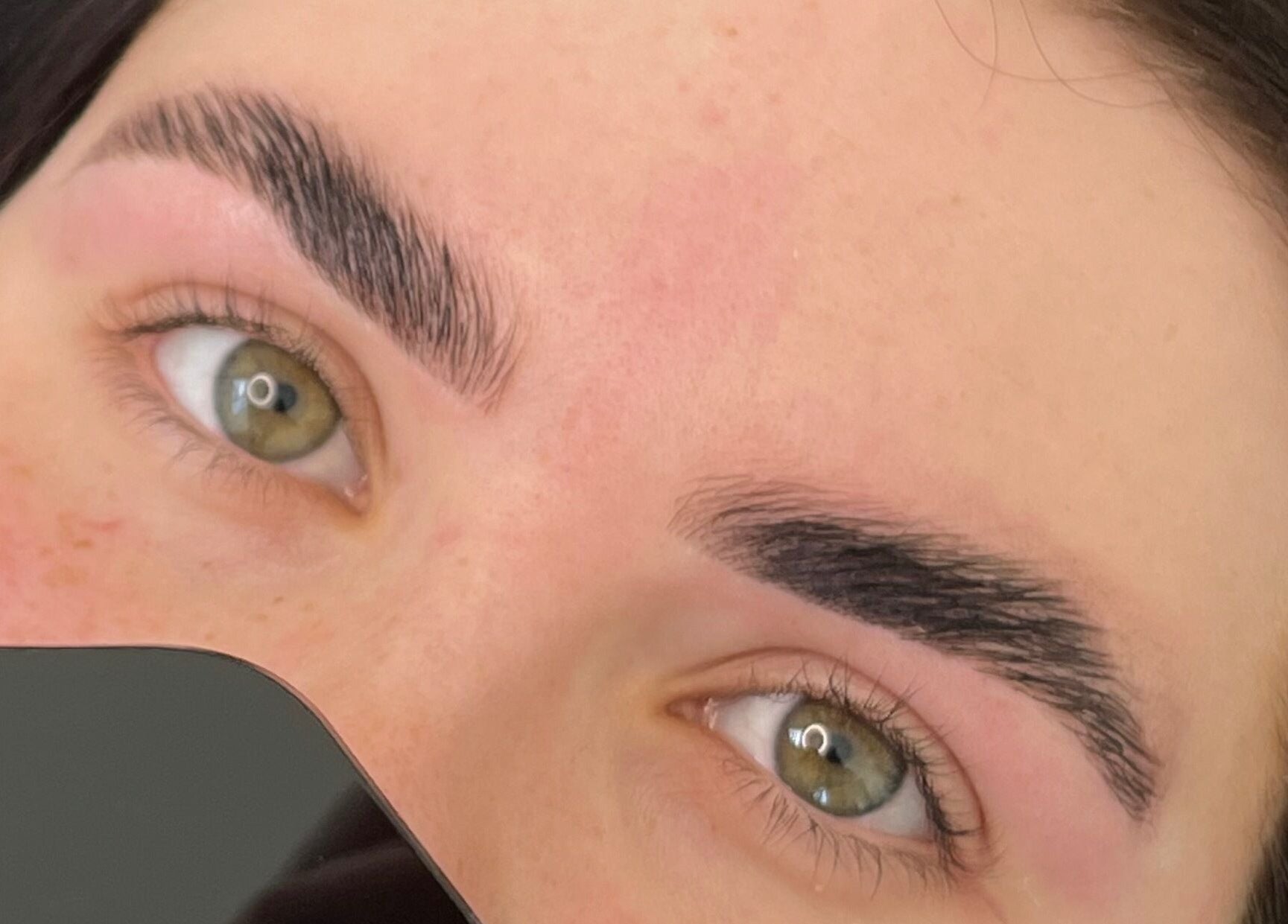 Close-up of expertly shaped eyebrows at Trackside Beauty, Melbourne, Victoria, AU.