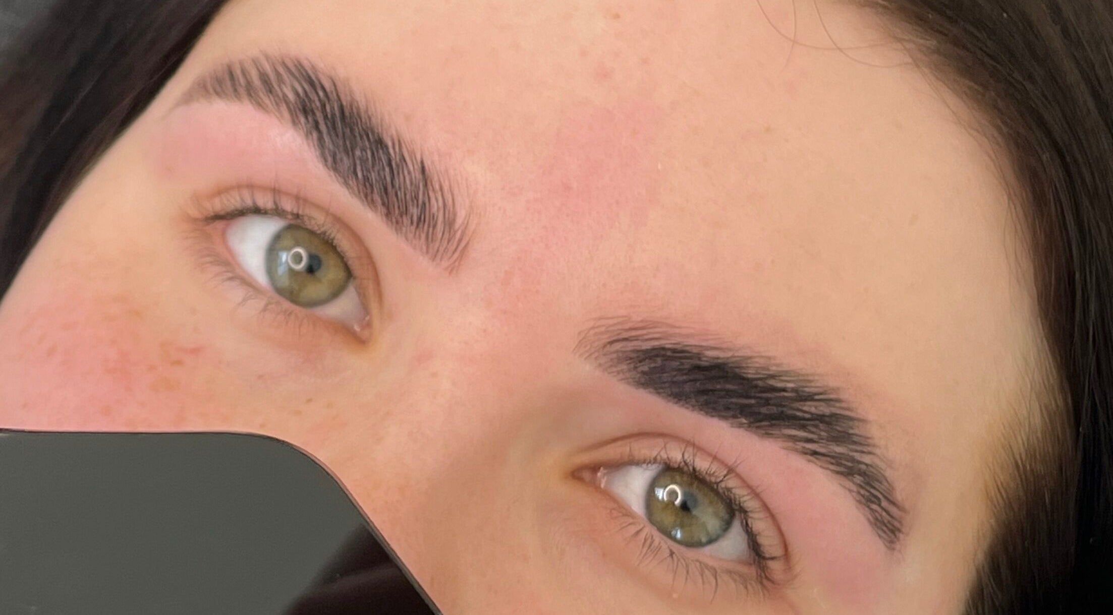 Close-up of expertly shaped eyebrows at Trackside Beauty, Melbourne, Victoria, AU.