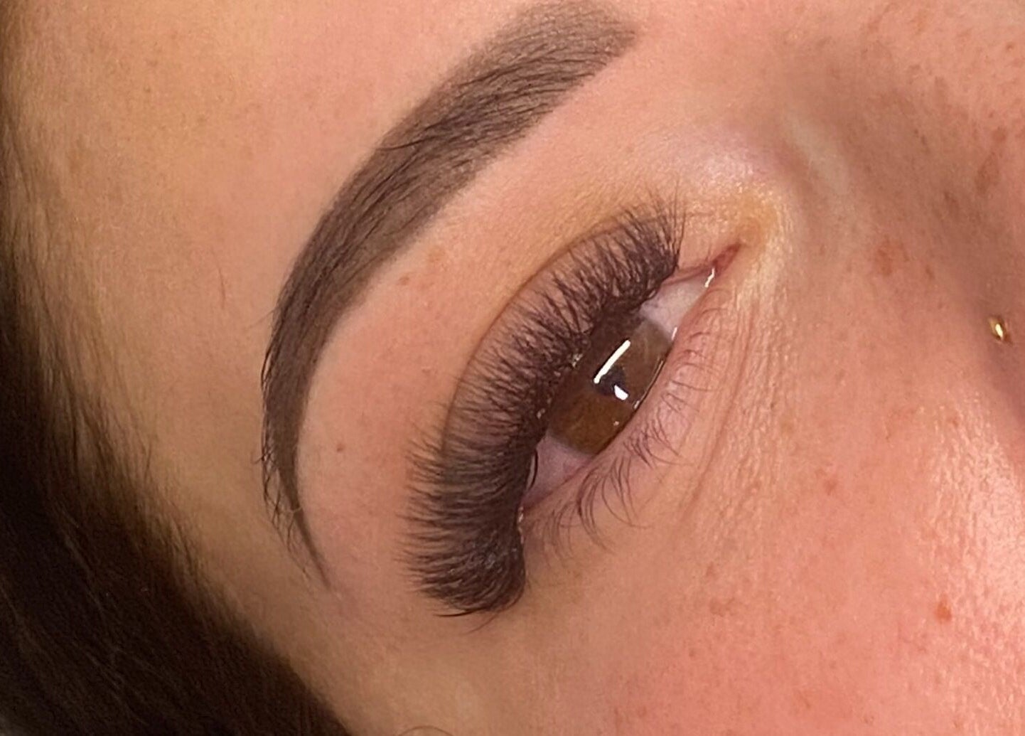 Close-up of eyelash extensions at Trackside Beauty, Melbourne, Victoria, AU, showcasing perfectly styled thick lashes.