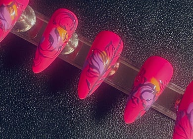 Vibrant floral nail art displayed at Silked by MJ in Frinton-on-sea, England, GB.