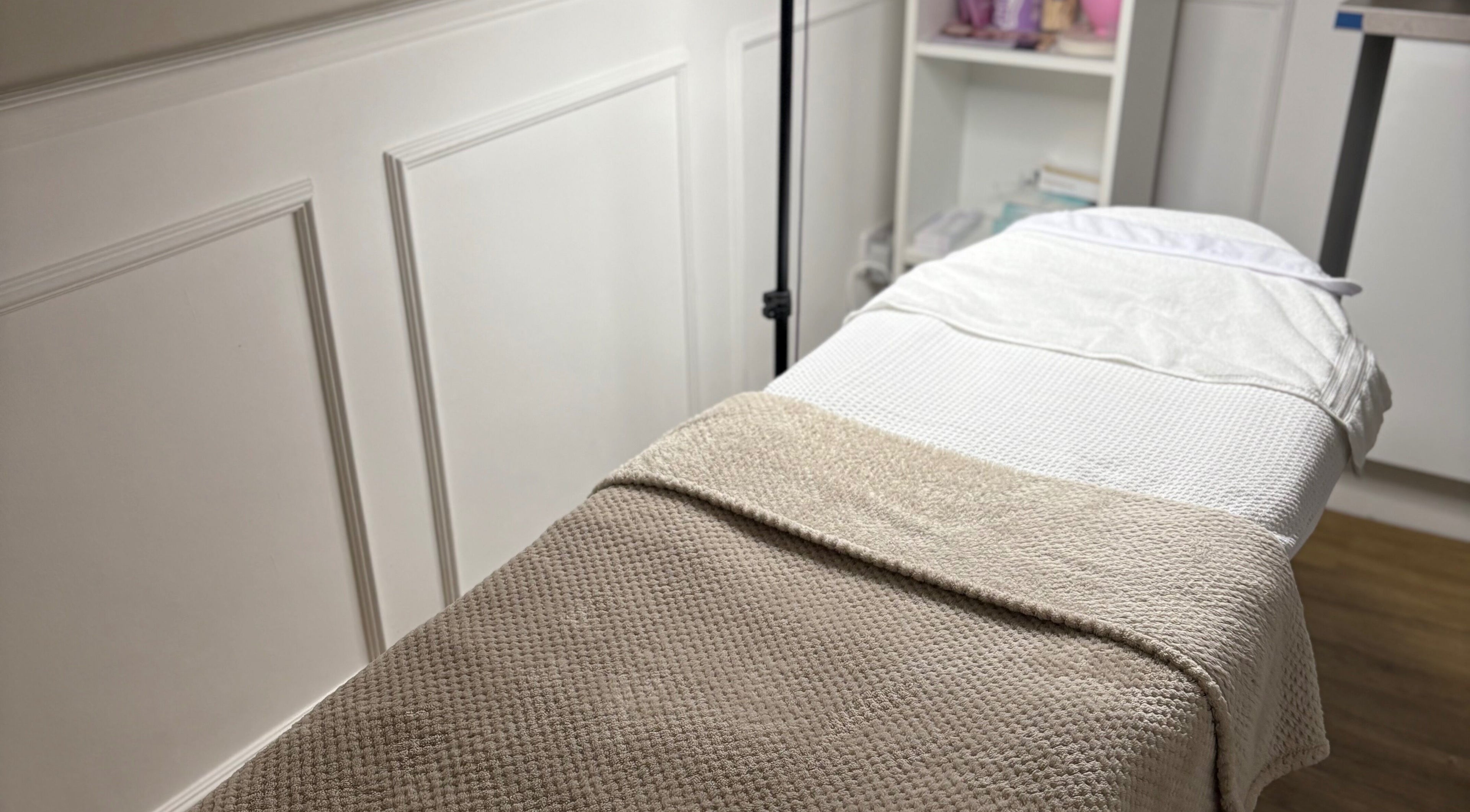 Comfortable treatment bed at Bay Skin Clinic in North Shields, England, GB offering relaxing wellness services.