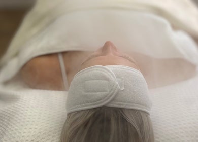 A client enjoys a soothing facial treatment at Bay Skin Clinic, North Shields, England, GB.