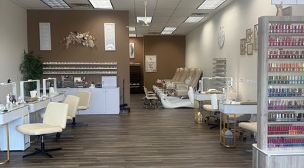 Elegant interior of Emkayy Nails, Neenah, Wisconsin, US, showcasing nail stations and pedicure chairs.