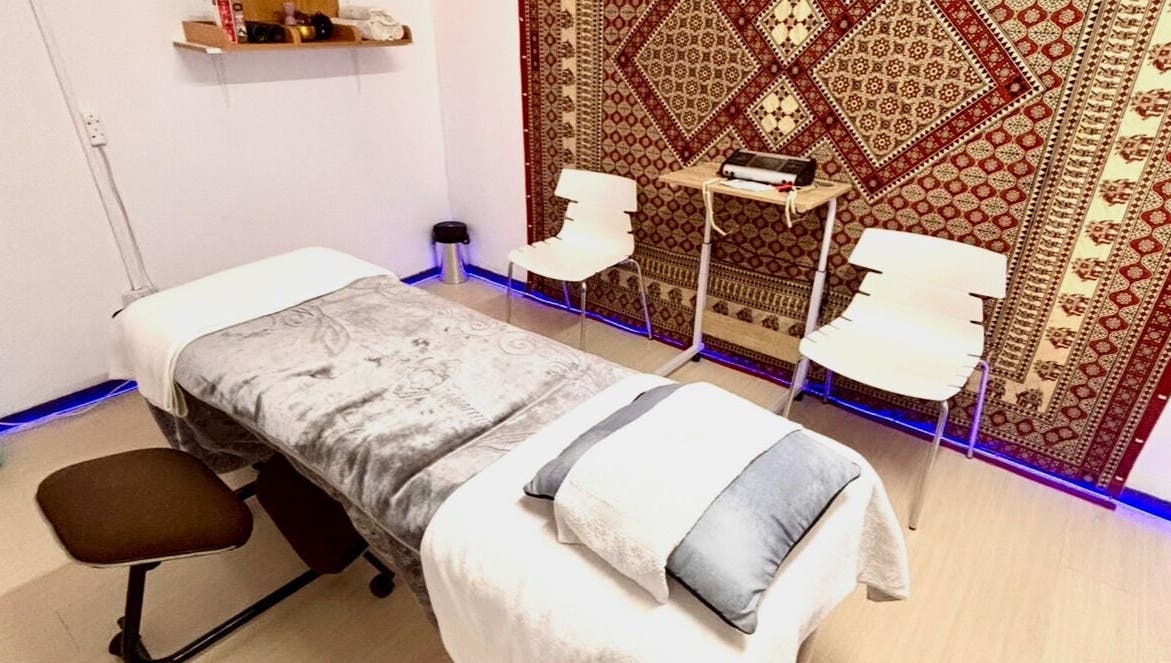 Relaxing massage room at Hands of Healing in Cape Town, Western Cape, ZA featuring cozy decor and calming ambiance.