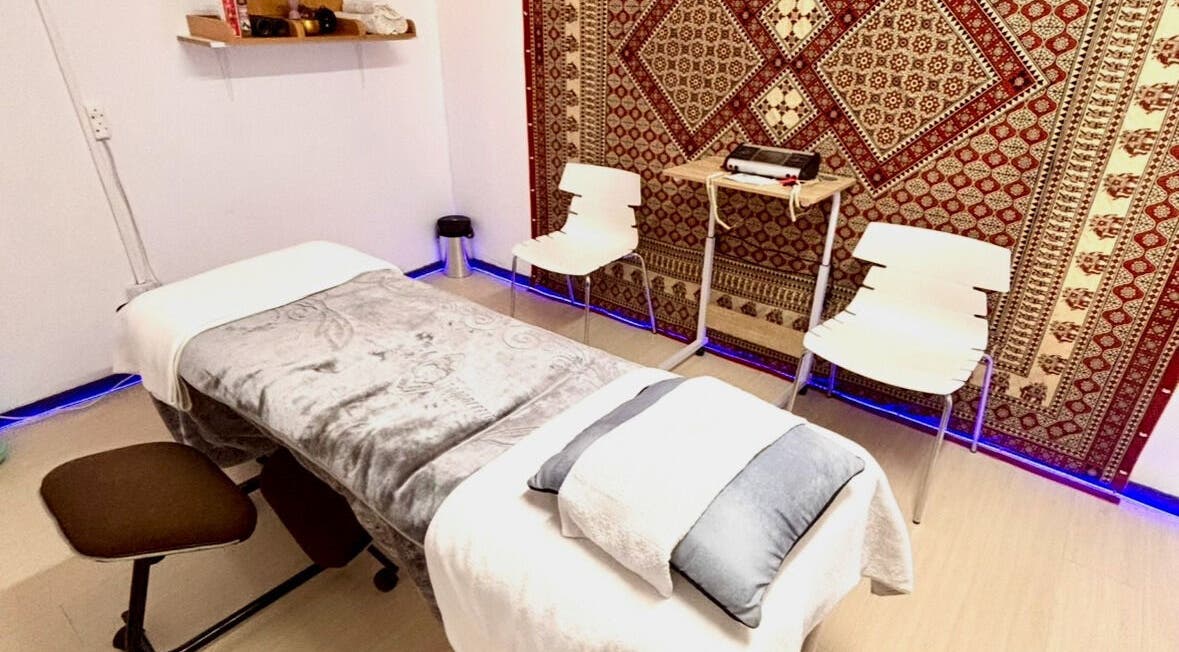 Relaxing massage room at Hands of Healing in Cape Town, Western Cape, ZA featuring cozy decor and calming ambiance.
