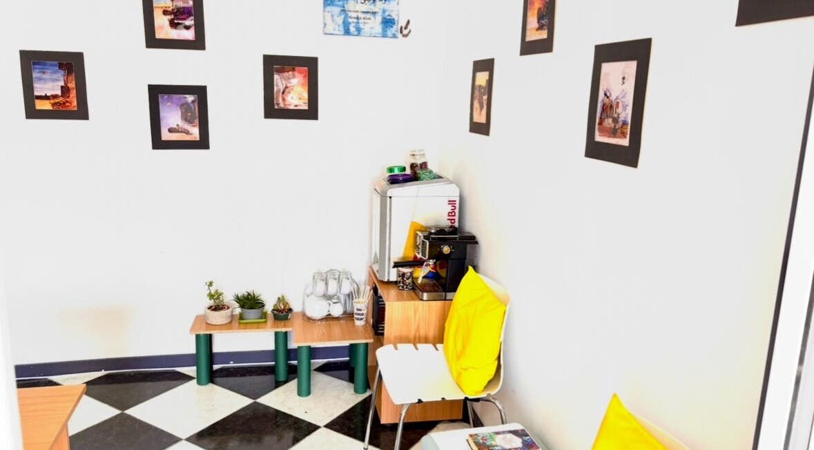 Inviting nook at Hands of Healing in Cape Town, Western Cape, ZA featuring vibrant decor and seating.