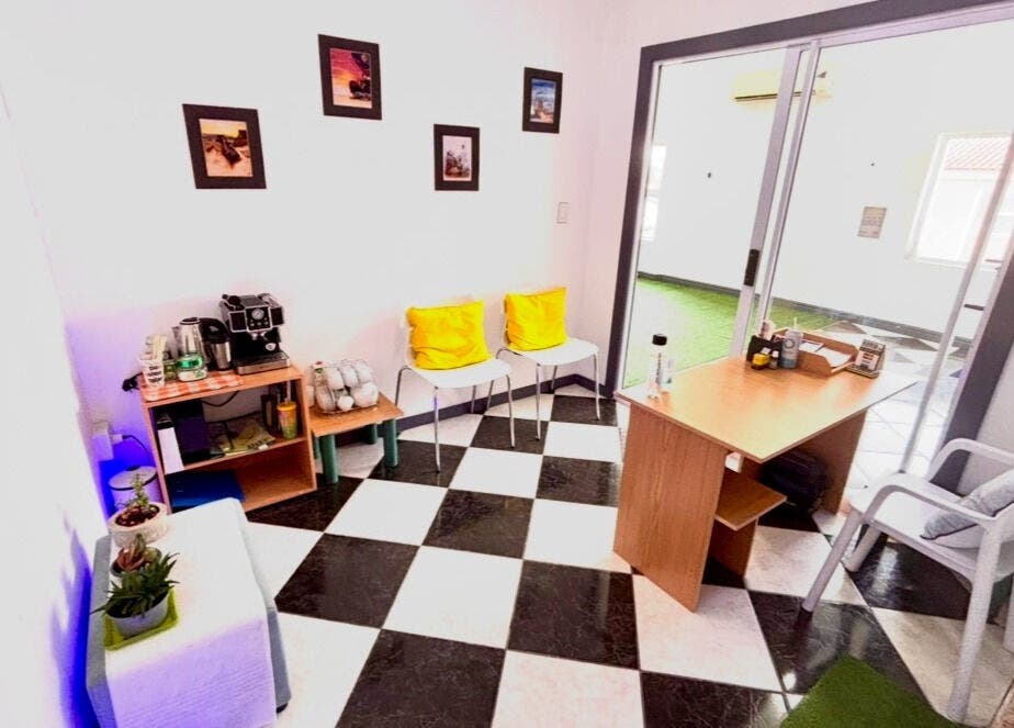 Cozy waiting area at Hands of Healing, Cape Town, Western Cape, ZA with bright decor and coffee station.