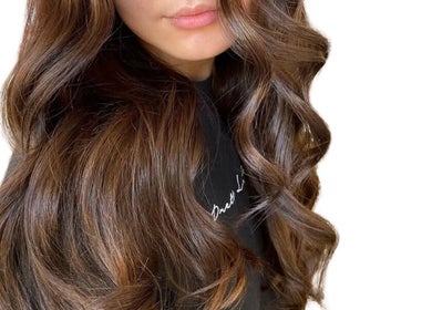 Beautiful brunette curls styled at Hair By Immy in Birmingham, England, GB, showcasing luxurious hair texture.