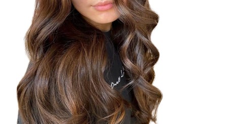 Beautiful brunette curls styled at Hair By Immy in Birmingham, England, GB, showcasing luxurious hair texture.
