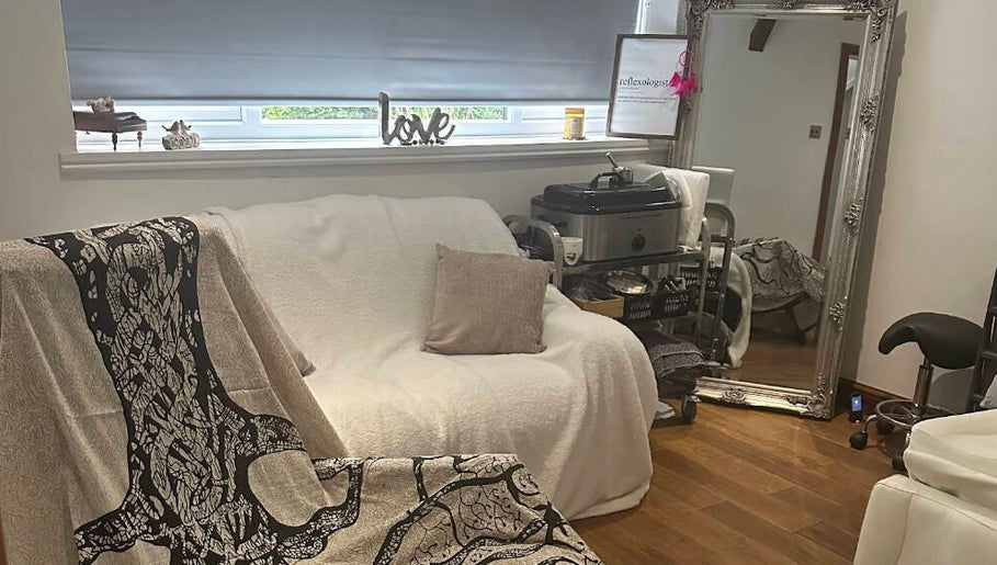 Cozy therapy room at Reflexology by Joanna in Coventry, England, GB with modern decor and comfortable seating.