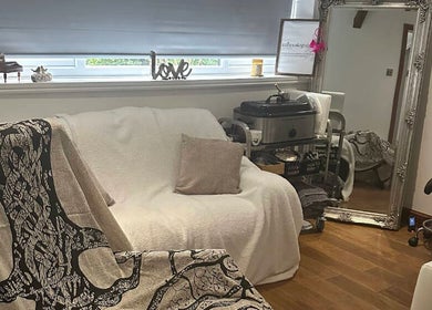 Cozy therapy room at Reflexology by Joanna in Coventry, England, GB with modern decor and comfortable seating.